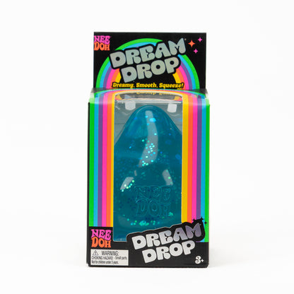 Blue glitter NeeDoh Dream Drop in its original retail packaging, front view.
